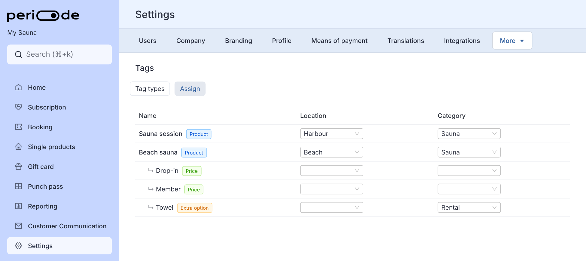 The Assign tab under Settings, Tags. The table has the columns Name, Location and Category. Sauna session is tagged Harbour and Sauna, Beach sauna is tagged Beach and Sauna, its prices Drop-in and Member have no tags, and its extra option Towel is tagged Rental under Category.